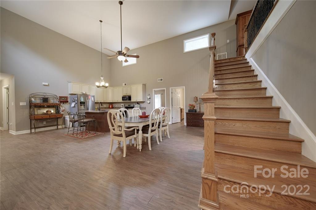 3579 Harmony Road Catawba, SC 29704 - Photo 23 of 48 a view of a dining room and livingroom with furniture wooden floor a chandelier