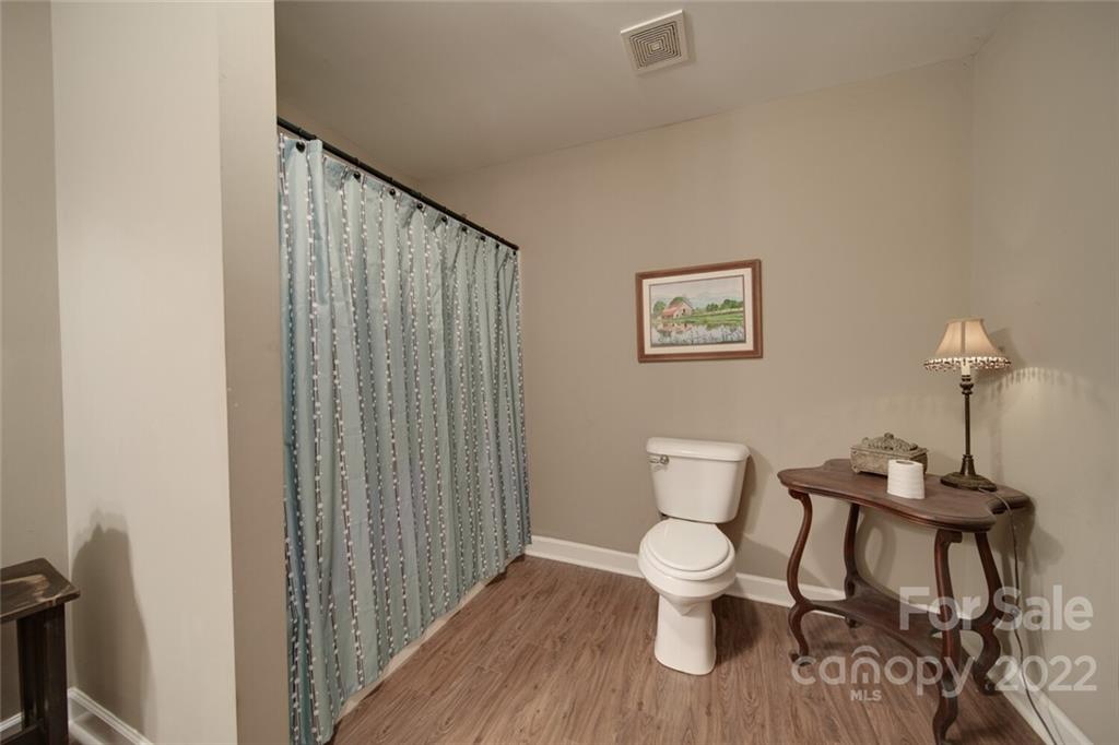 3579 Harmony Road Catawba, SC 29704 - Photo 26 of 48 a bathroom with a toilet and a mirror