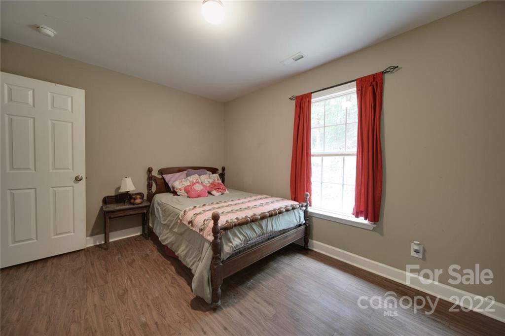 3579 Harmony Road Catawba, SC 29704 - Photo 28 of 48 a bedroom with a bed and window