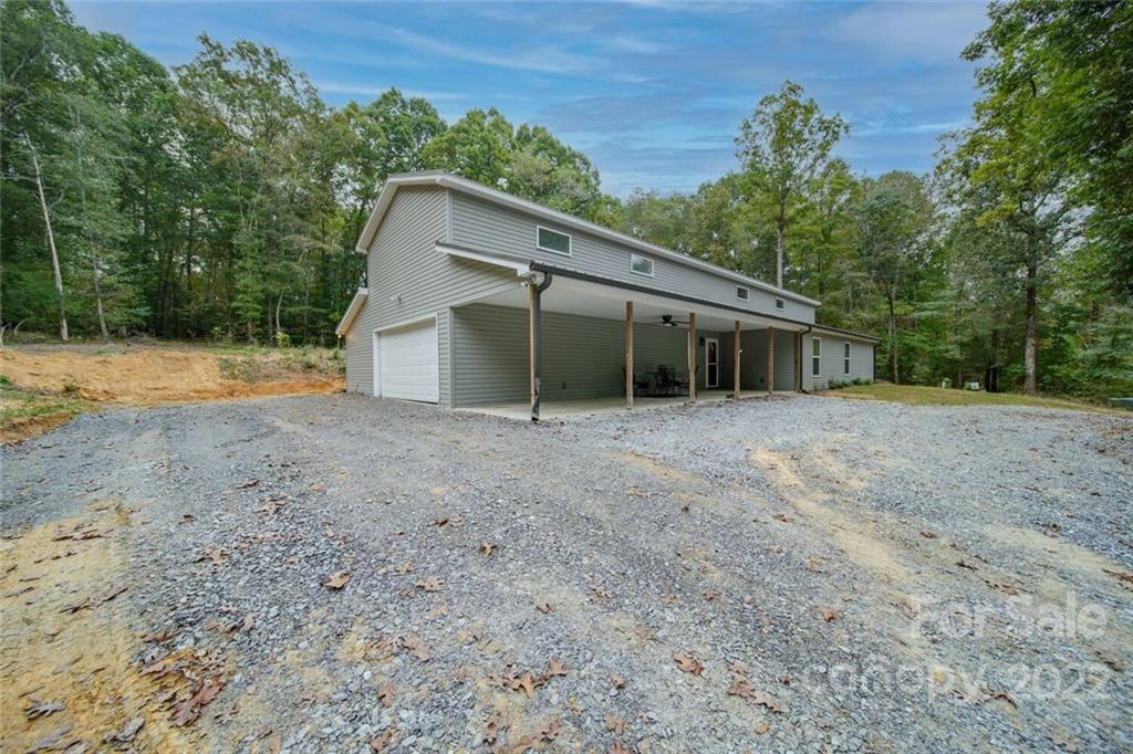 3579 Harmony Road Catawba, SC 29704 - Photo 44 of 48 a view of a house with a backyard and trees