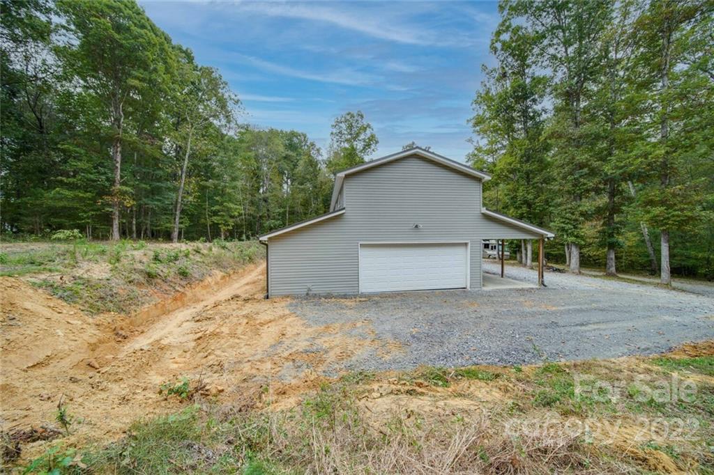 3579 Harmony Road Catawba, SC 29704 - Photo 47 of 48 a house with trees in the background