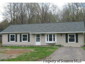 144 Creamery Road Tunkhannock, PA 18657 - Photo 1 of 1 a backyard of a house with seating space