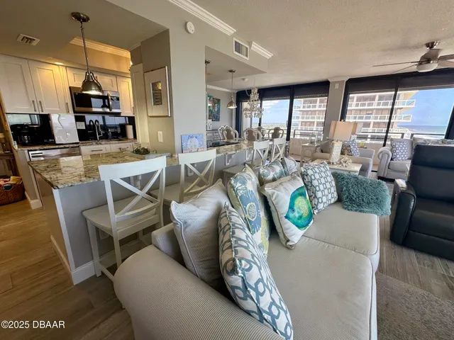 a view of a dining room with furniture window and outside view