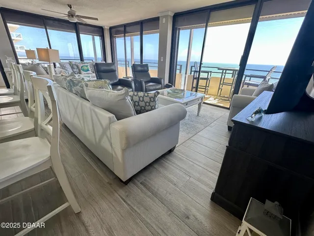 a living room with furniture and a large window