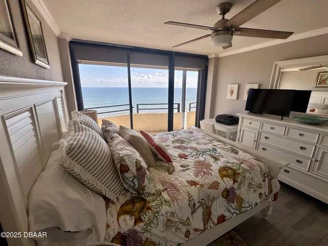 a bathroom with a granite countertop sink toilet a mirror and shower