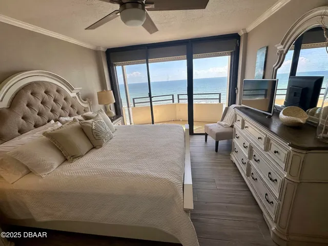 a bathroom with a sink and mirror with bathtub