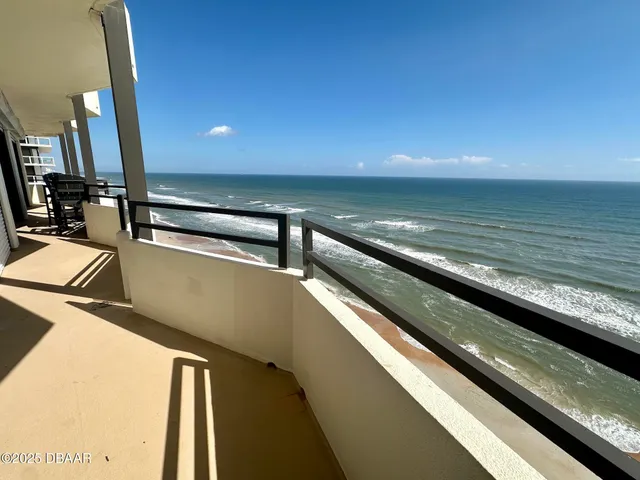 a view of ocean from a balcony
