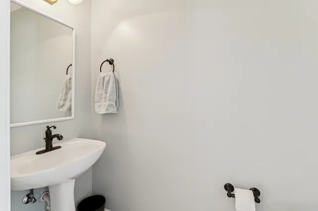 a bathroom with a sink and mirror