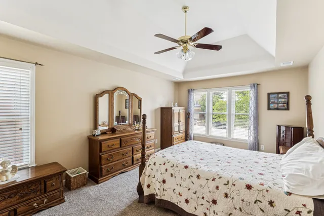 a bedroom with a bed and a dresser