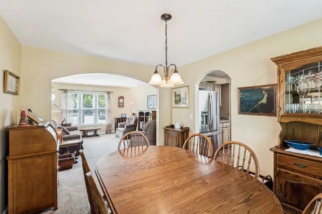 a view of a dining room with furniture window and outside view