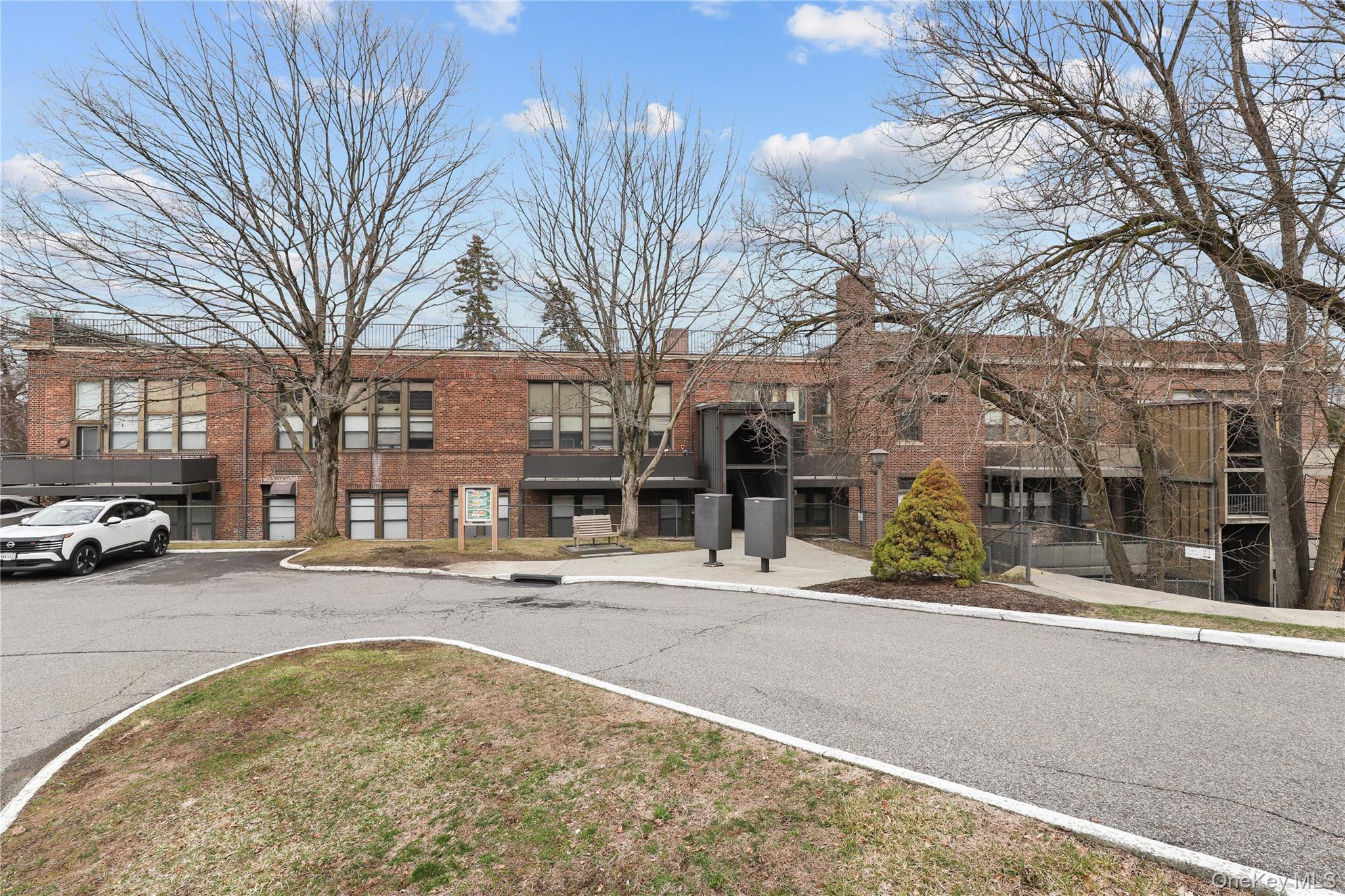 60 Kensico Road, Unit 22 Thornwood, NY 10594 - Photo 12 of 14 a view of a street with houses