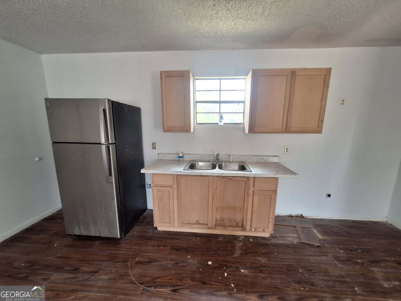3606 24th Avenue Valley, AL 36854 - Photo 5 of 11 a kitchen with a refrigerator sink and cabinets