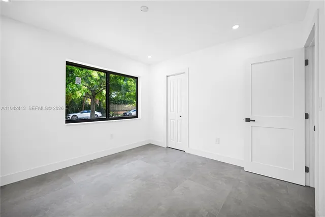 a view of an empty room with a window