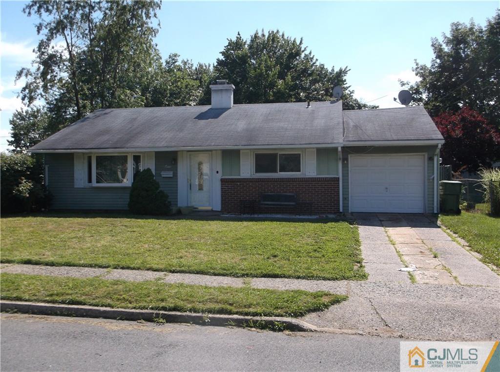 12 Baxter Road Edison, NJ 08817 - Photo 1 of 6 a front view of a house with a garden
