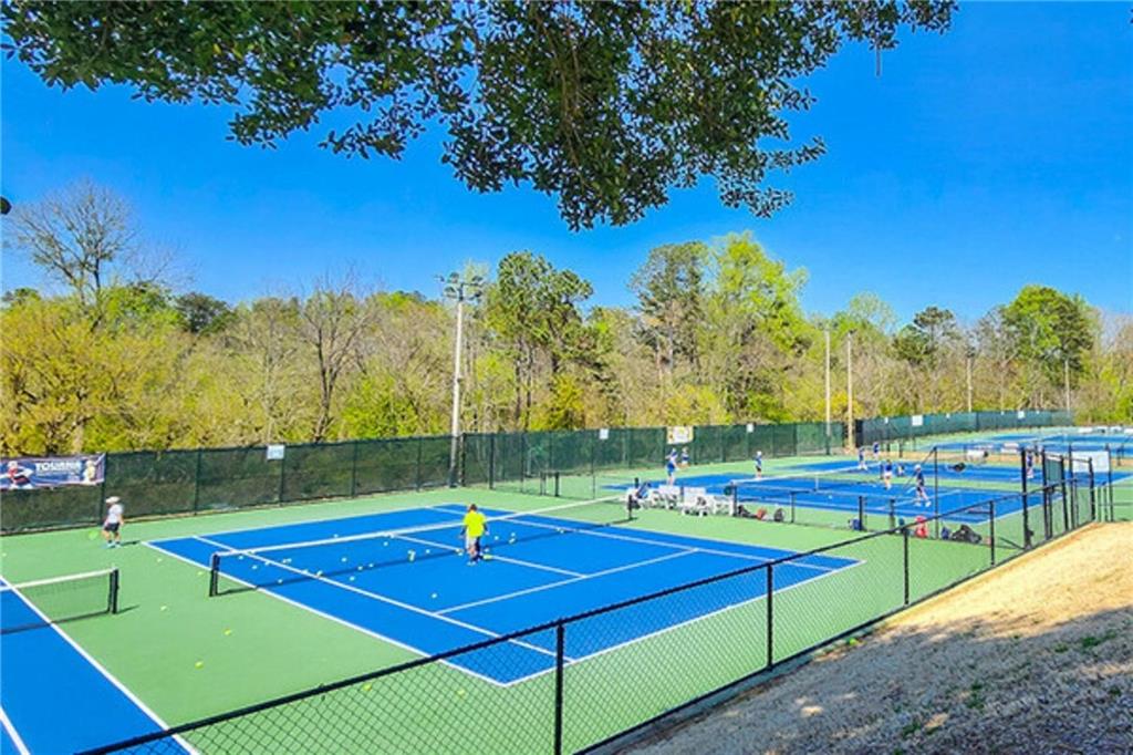 318 Sandy Springs Circle, Unit 320 Atlanta, GA 30328 - Photo 21 of 26 a view of an outdoor space and tennis court
