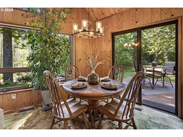 a view of a dining room with furniture window and outside view