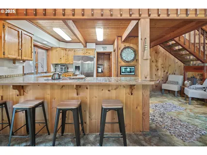 a kitchen with stainless steel appliances granite countertop a sink and a cabinets
