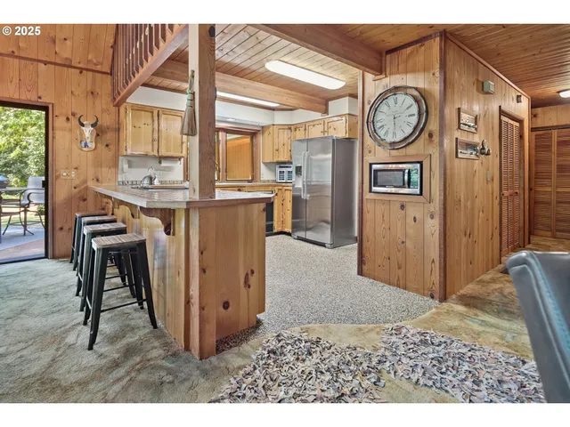 a view of a hallway with washer and dryer