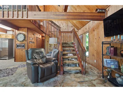 a living room with furniture and a clock