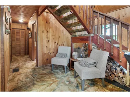 a living room with furniture and a rug