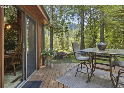 a view of a chairs and table in the balcony