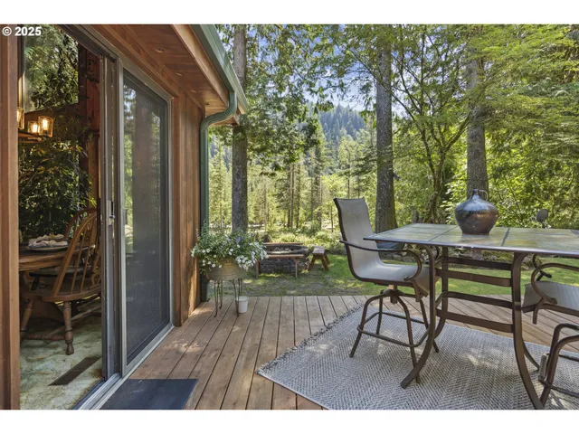 a view of a chairs and table in the balcony