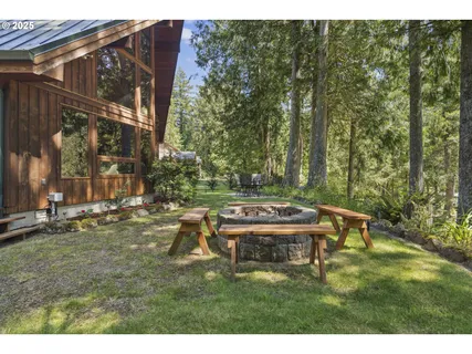 a backyard of a house with table and chairs