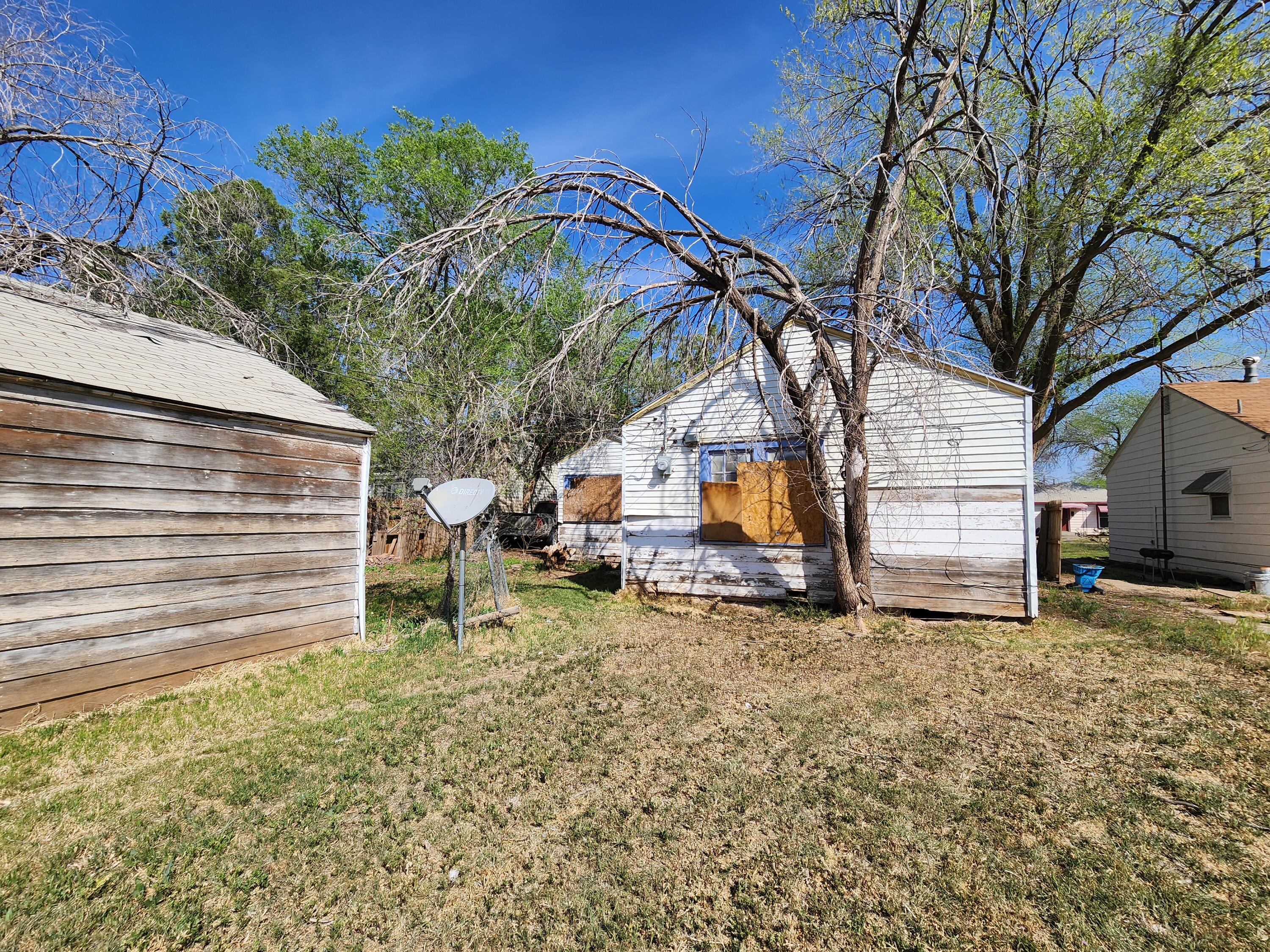 4-properties 4-properties Fixer Package Lubbock, TX 79403 - Photo 23 of 39 a view of a house with a yard