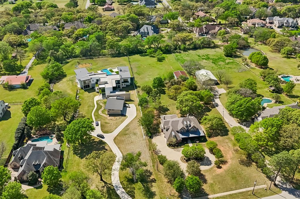 4604 Bill Simmons Road Colleyville, TX 76034 - Photo 9 of 22 an aerial view of a house with a yard and lake view