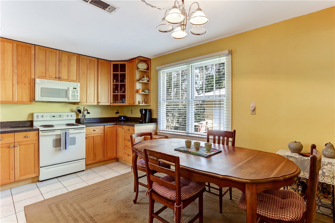603 Broome Street Fernandina Beach, FL 32034 - Photo 15 of 33 a view of a dining room with furniture window and wooden floor