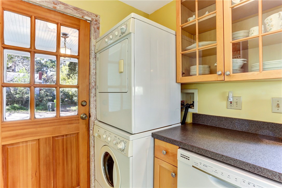 603 Broome Street Fernandina Beach, FL 32034 - Photo 17 of 33 a kitchen with a refrigerator and a window
