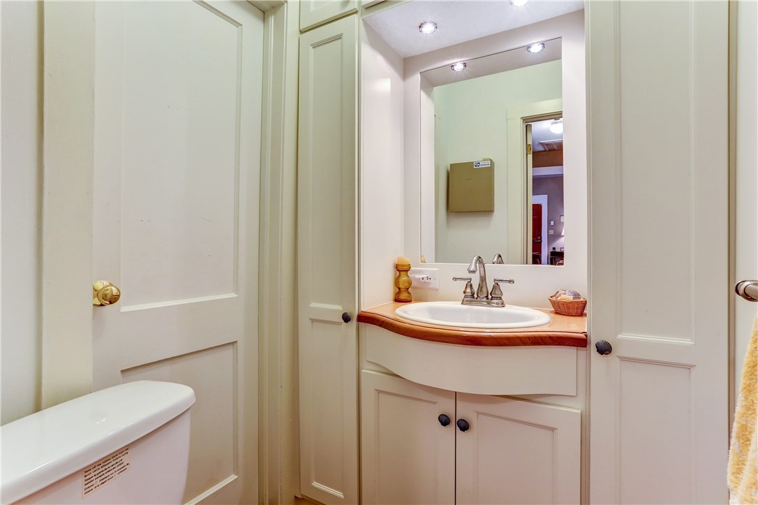 603 Broome Street Fernandina Beach, FL 32034 - Photo 18 of 33 a bathroom with a sink and a mirror