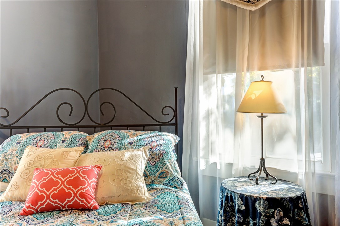 603 Broome Street Fernandina Beach, FL 32034 - Photo 20 of 33 a bed room with a bed and a table
