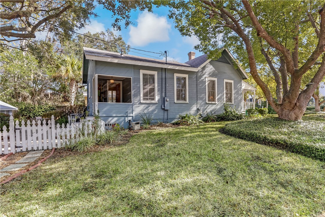603 Broome Street Fernandina Beach, FL 32034 - Photo 26 of 33 a front view of house with yard and trees
