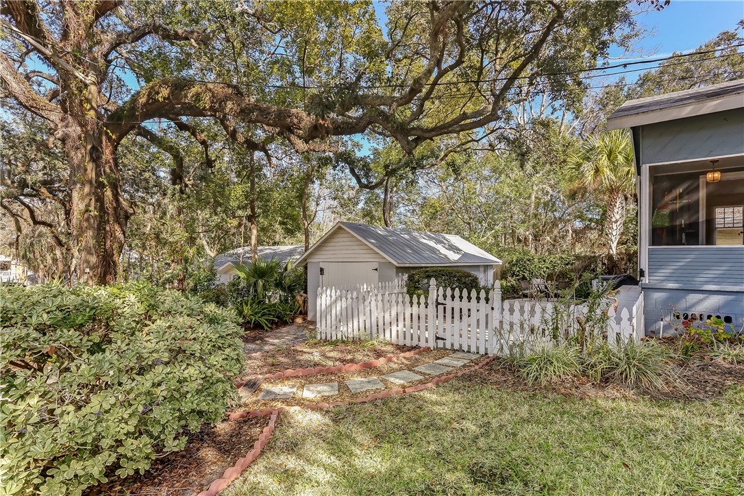 603 Broome Street Fernandina Beach, FL 32034 - Photo 28 of 33 a front view of a house with a garden