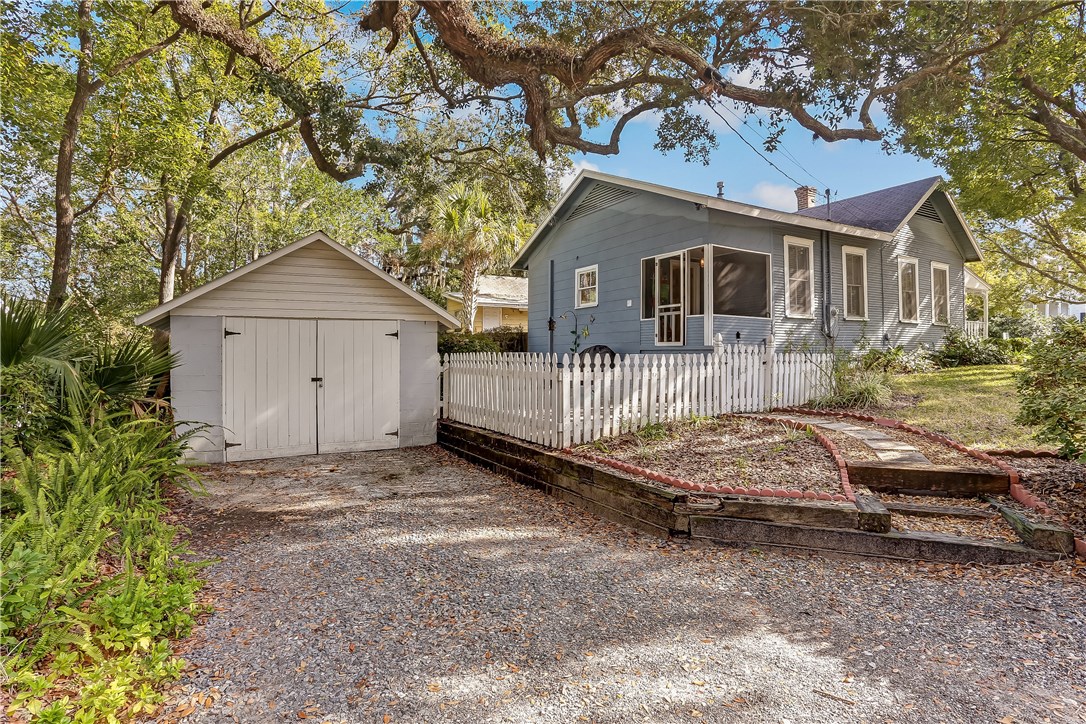 603 Broome Street Fernandina Beach, FL 32034 - Photo 29 of 33 a front view of a house with a yard and garage