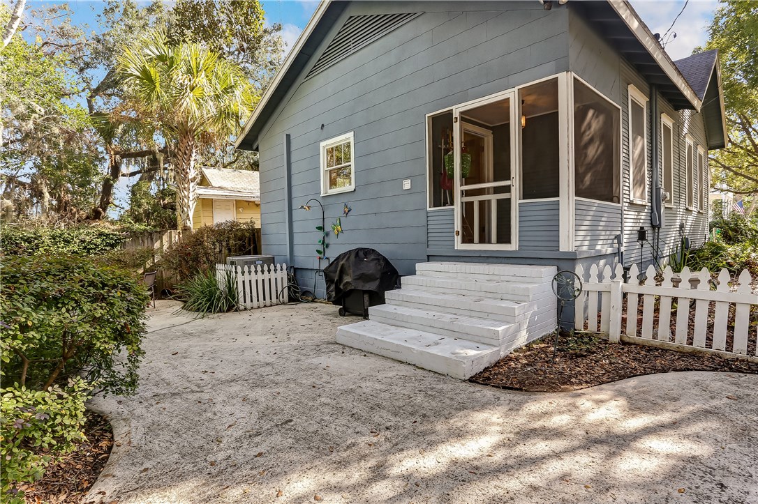 603 Broome Street Fernandina Beach, FL 32034 - Photo 30 of 33 a view of a house with a yard and wooden fence