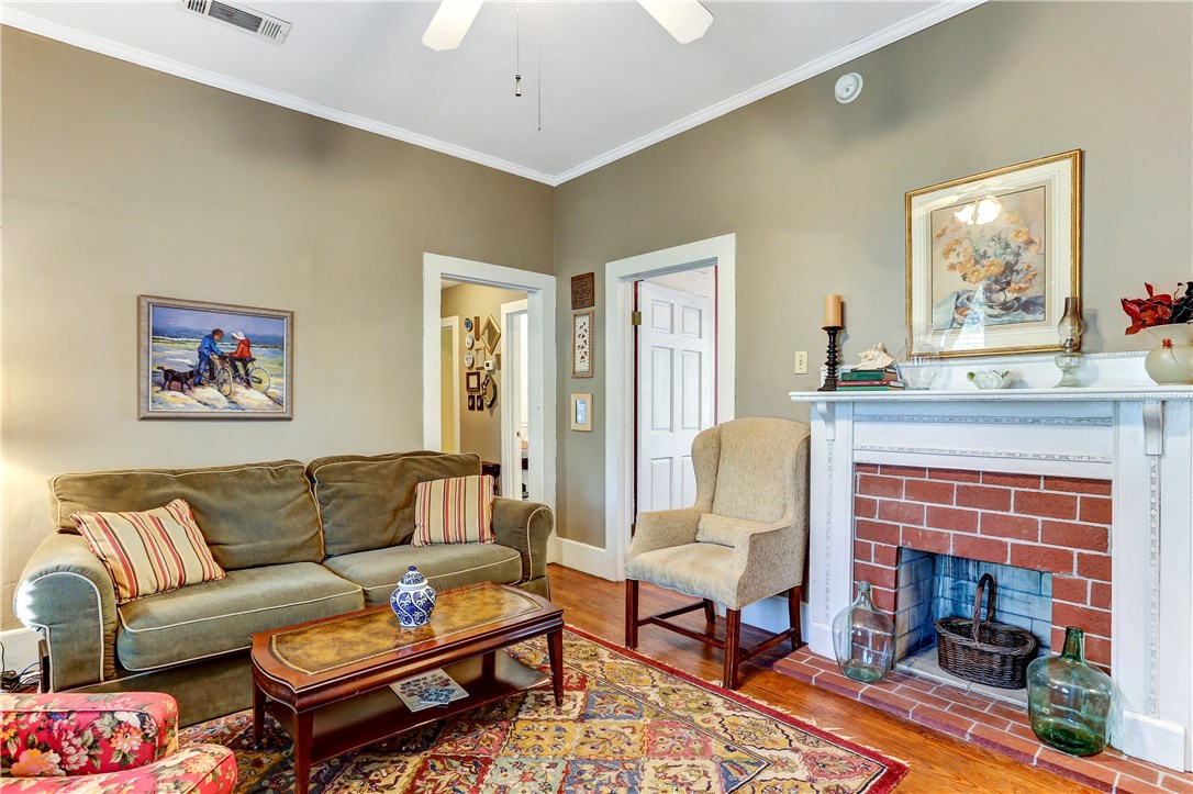 603 Broome Street Fernandina Beach, FL 32034 - Photo 3 of 33 a living room with furniture and a fireplace