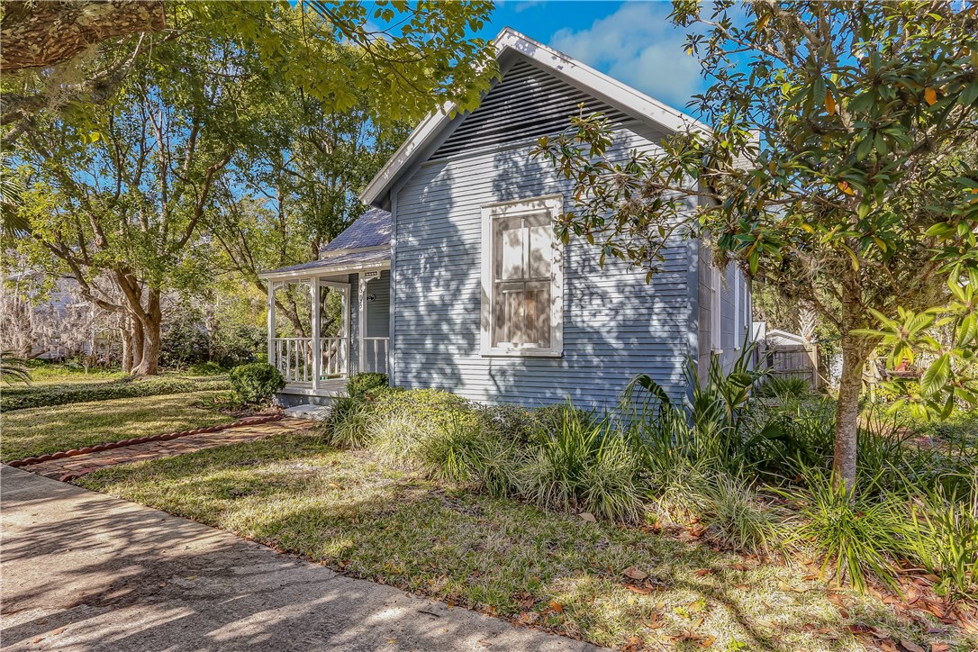 603 Broome Street Fernandina Beach, FL 32034 - Photo 31 of 33 a view of a house with a yard