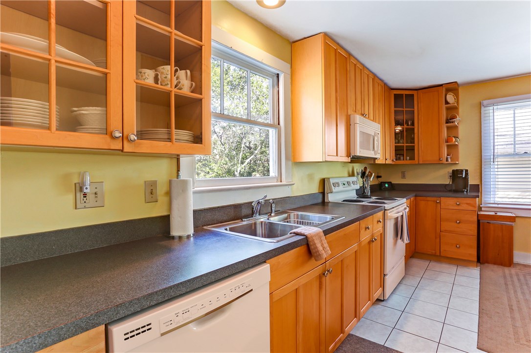 603 Broome Street Fernandina Beach, FL 32034 - Photo 4 of 33 a kitchen with stainless steel appliances a sink a stove and a window
