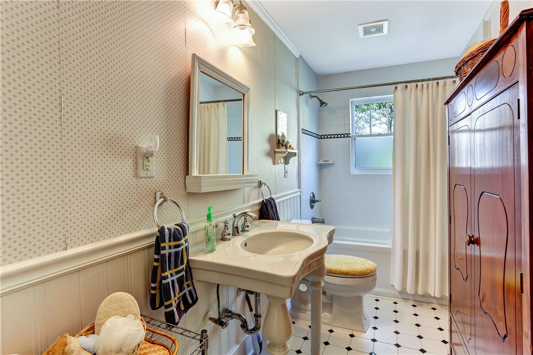 603 Broome Street Fernandina Beach, FL 32034 - Photo 6 of 33 a bathroom with a sink a toilet and shower
