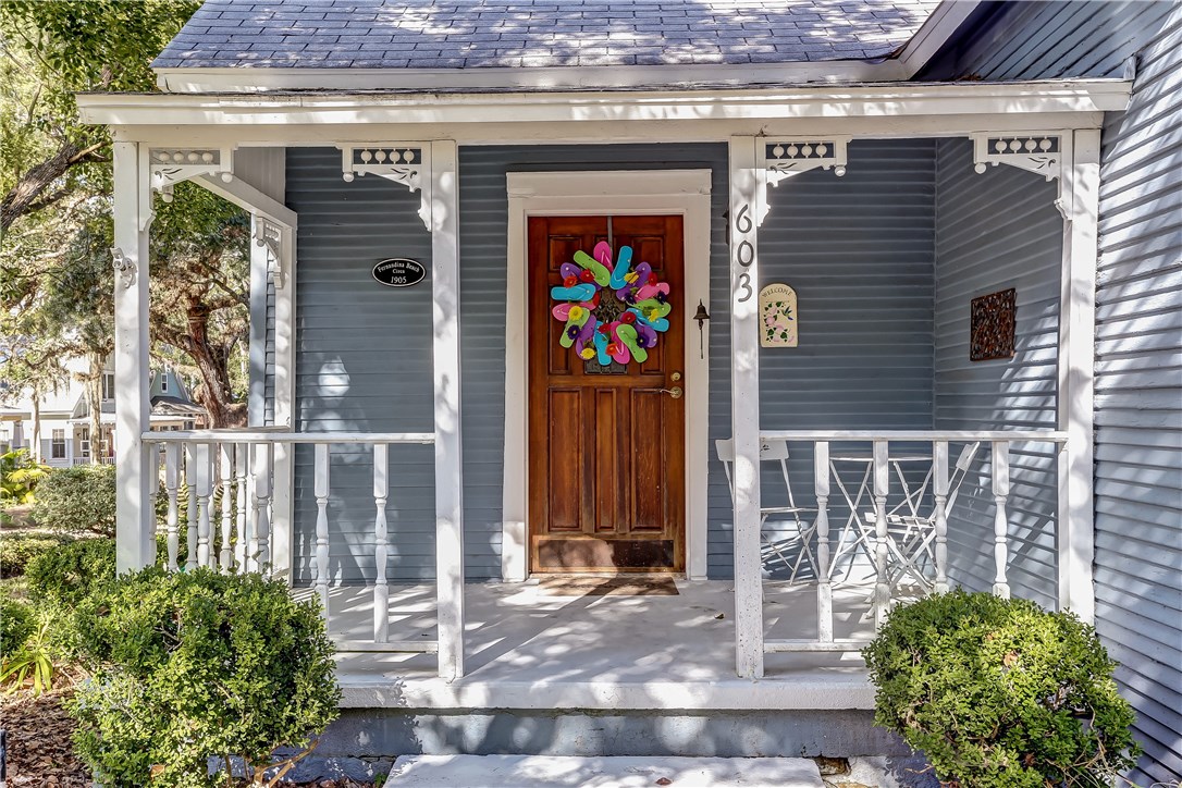 603 Broome Street Fernandina Beach, FL 32034 - Photo 8 of 33 a front view of a house with a glass door