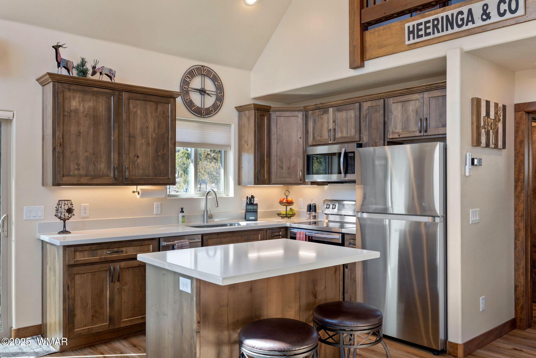 3402 Beaufeaux Road Overgaard, AZ 85933 - Photo 11 of 28 a kitchen with granite countertop a sink stainless steel appliances and cabinets