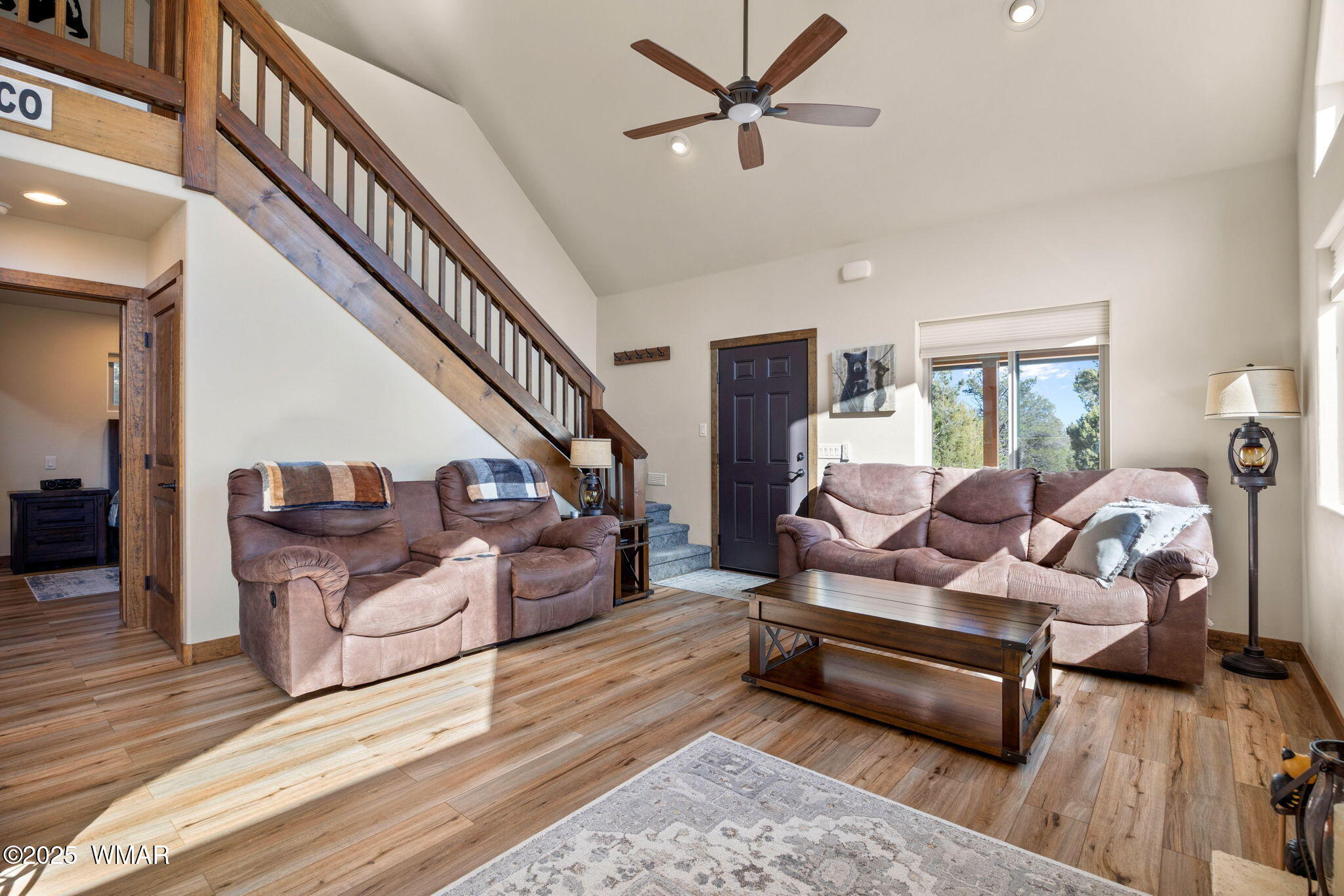 3402 Beaufeaux Road Overgaard, AZ 85933 - Photo 8 of 28 a living room with furniture and wooden floor