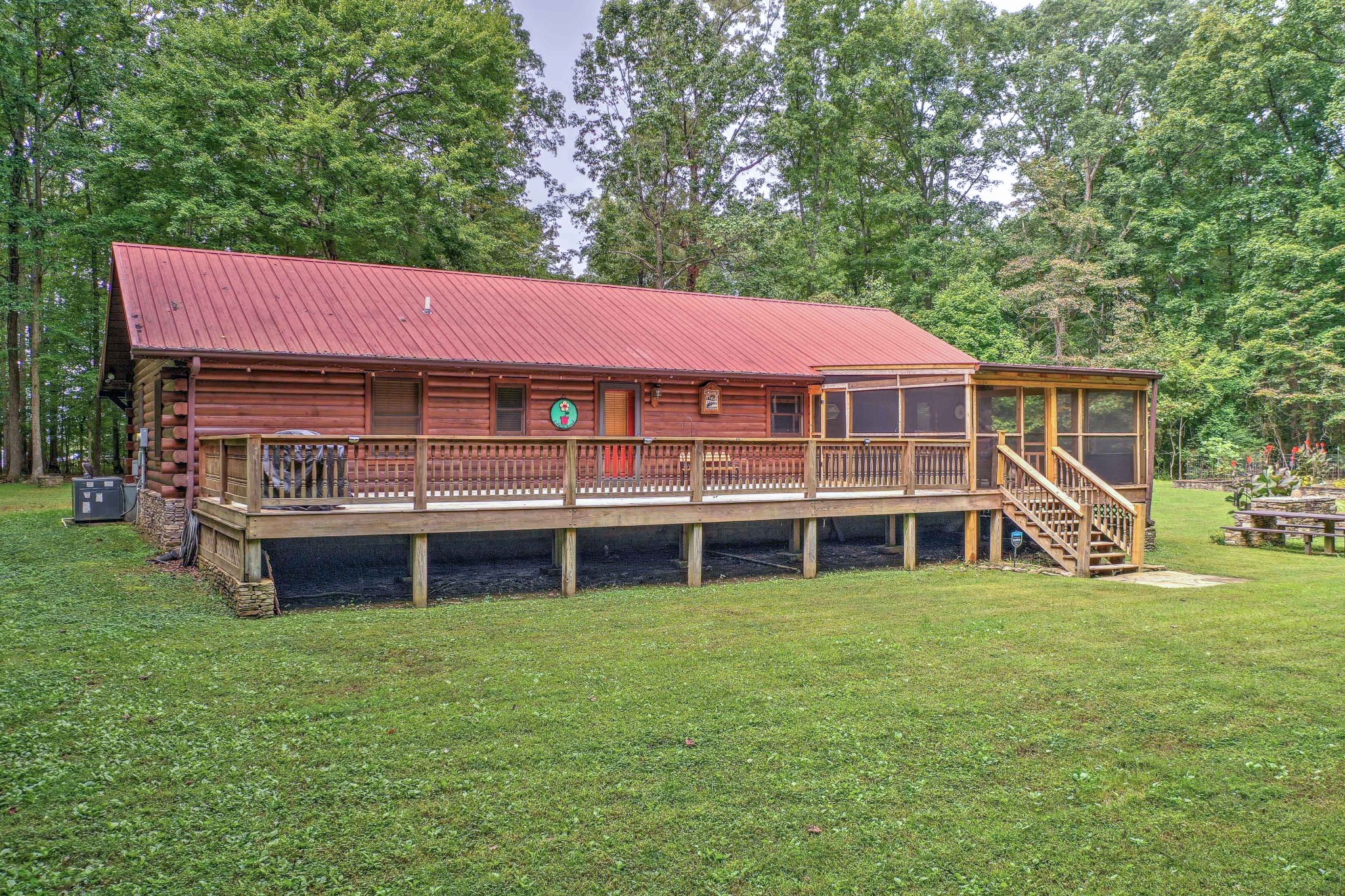 1331 Smith Thompson Road Bethpage, TN 37022 - Photo 10 of 35 a front view of a house with a garden and yard
