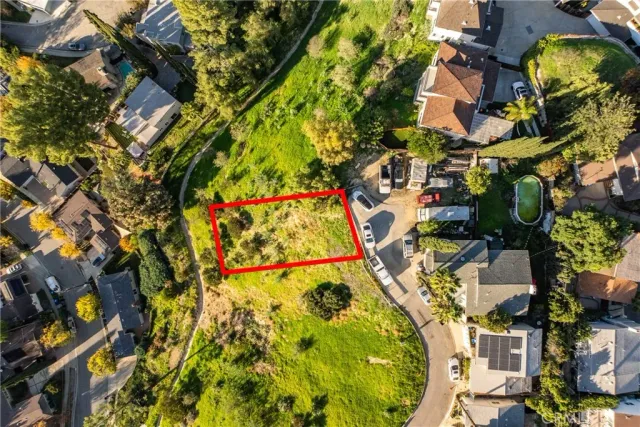 an aerial view of residential building with parking space