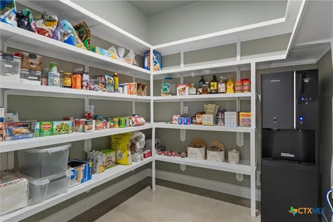 a room with an empty shelves