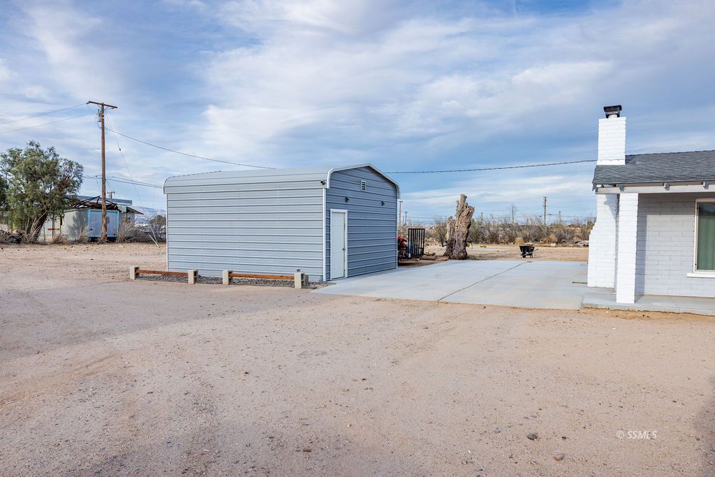 134 South Sierra View Street Ridgecrest, CA 93555 - Photo 34 of 43 a view of a parking space and a garage