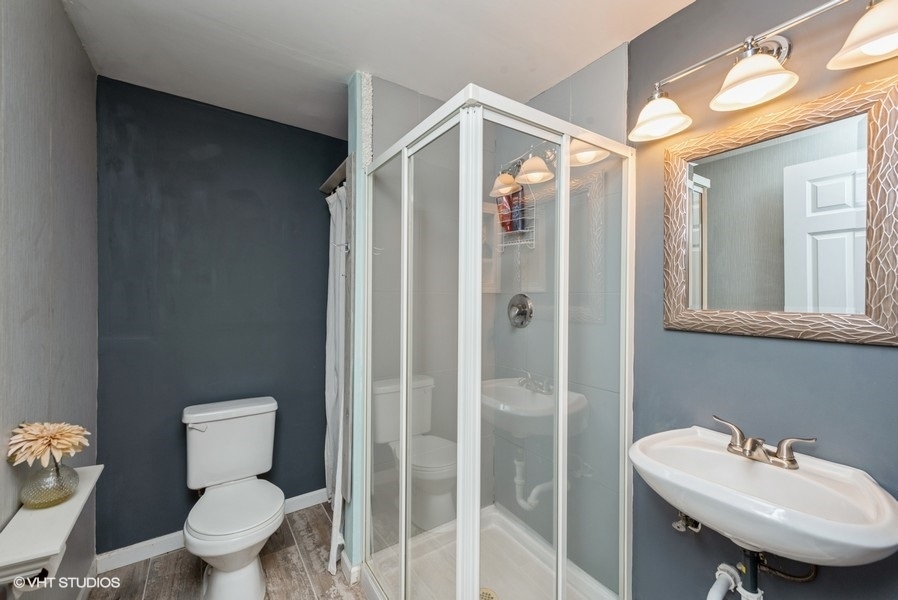 215 Rainier Way Fox Lake, IL 60020 - Photo 12 of 15 a bathroom with a sink toilet and shower