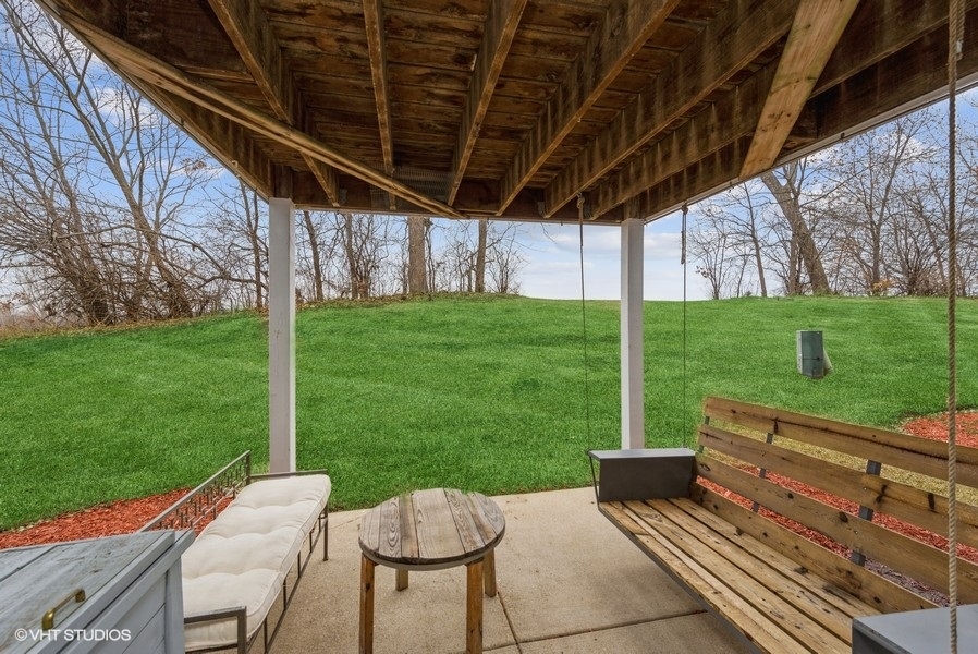 215 Rainier Way Fox Lake, IL 60020 - Photo 14 of 15 a view of a patio with a table chairs and a backyard